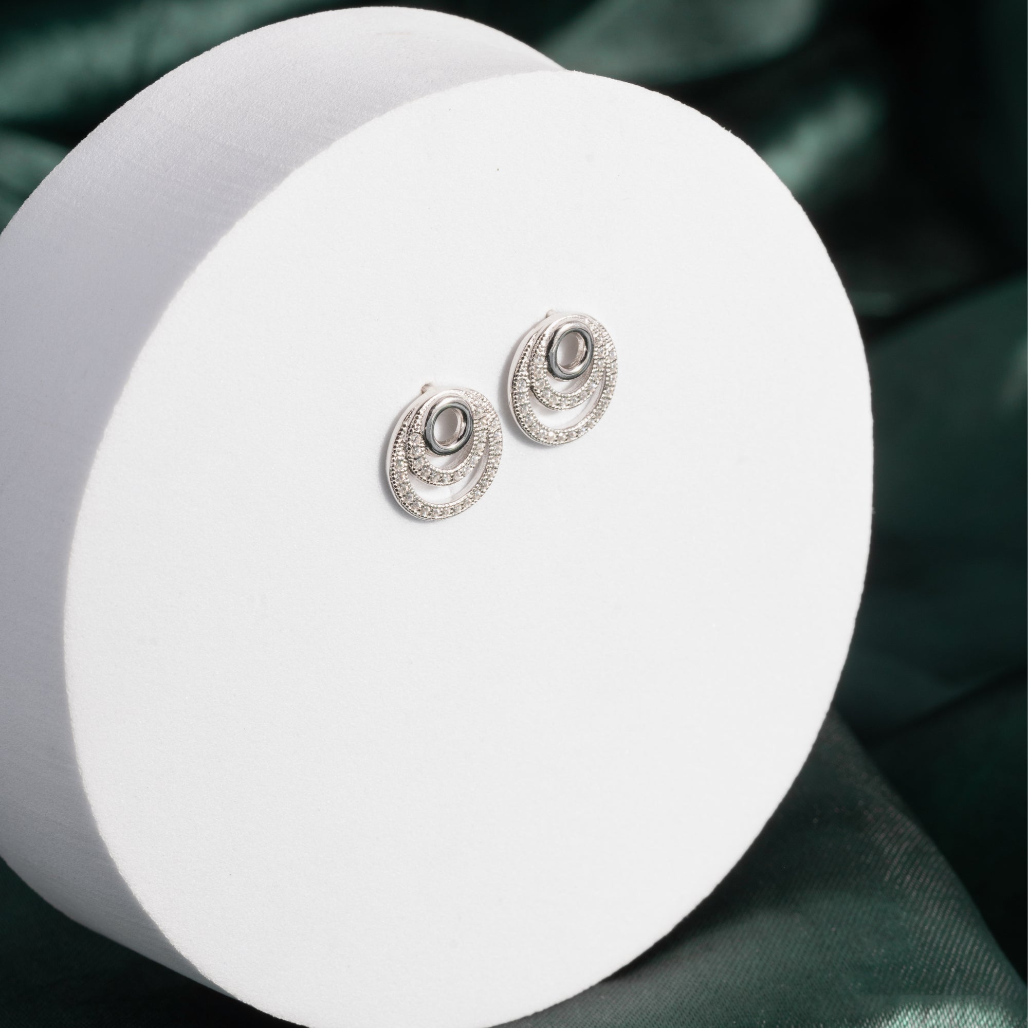 Cubic zirconia spiral dangly earrings