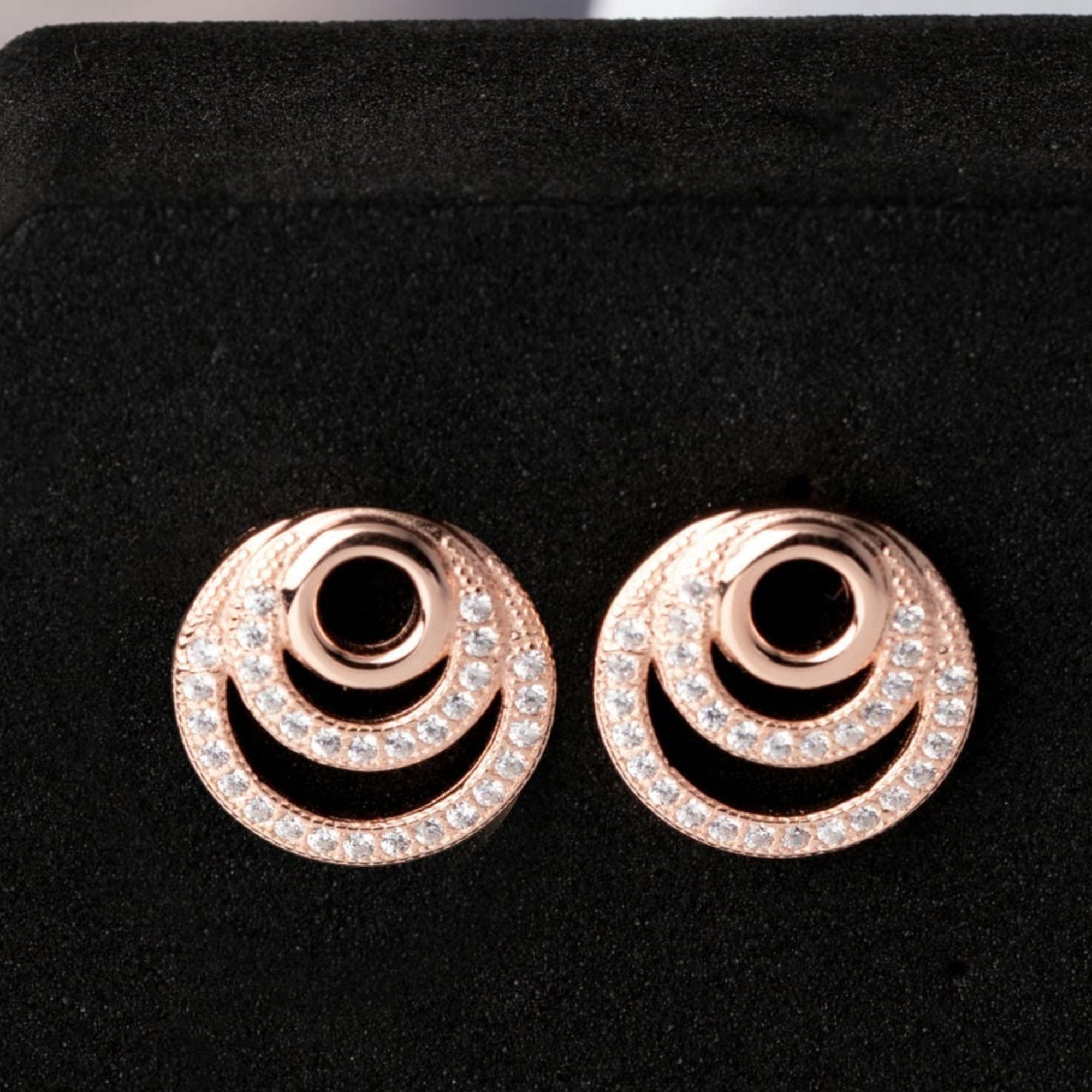 Cubic zirconia spiral dangly earrings